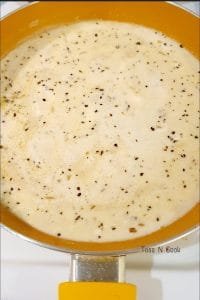 White sauce being prepared in a pan