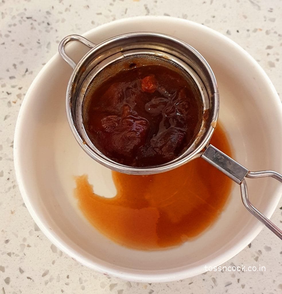 Straining Tamarind using a strainer