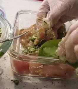 Tuck a spinach leaf at the opening to secure the filling