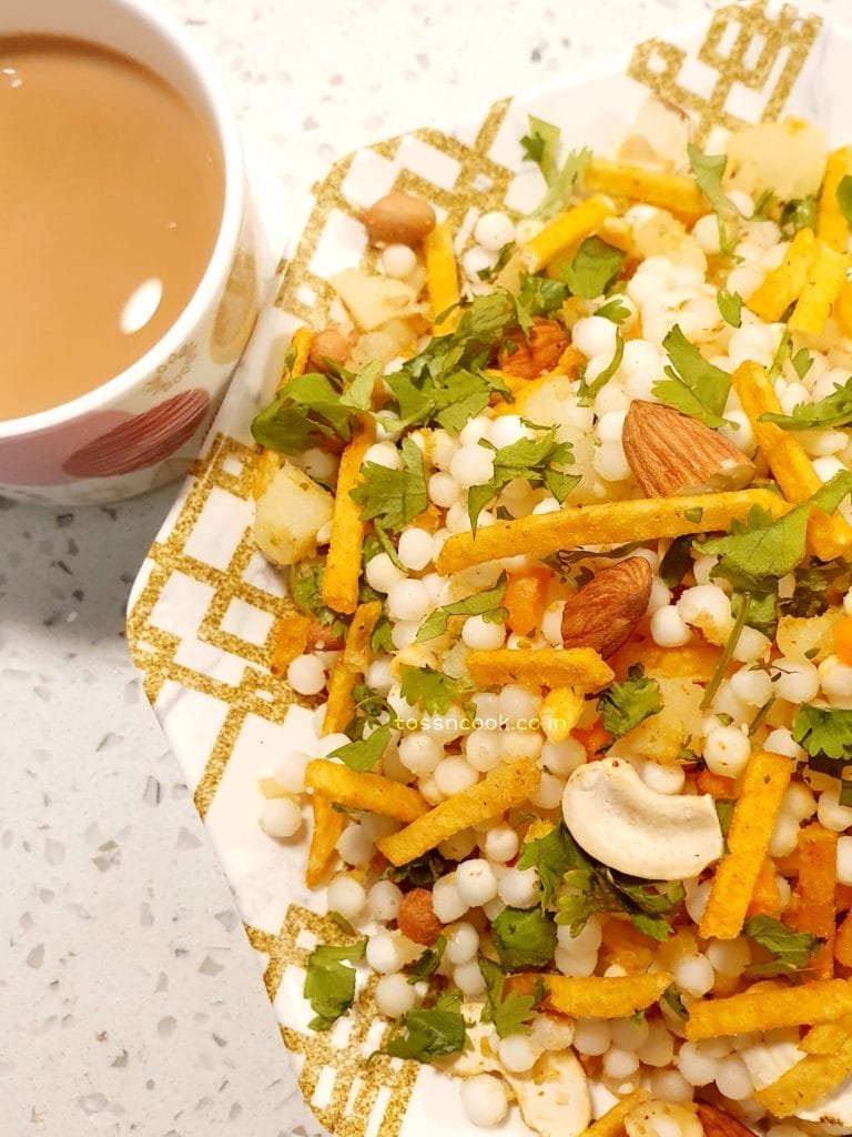 Sabudana Chaat served in a plate alongside a coffee